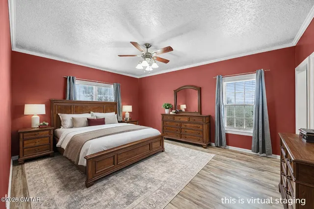 a bathroom with a granite countertop tub shower and mirror