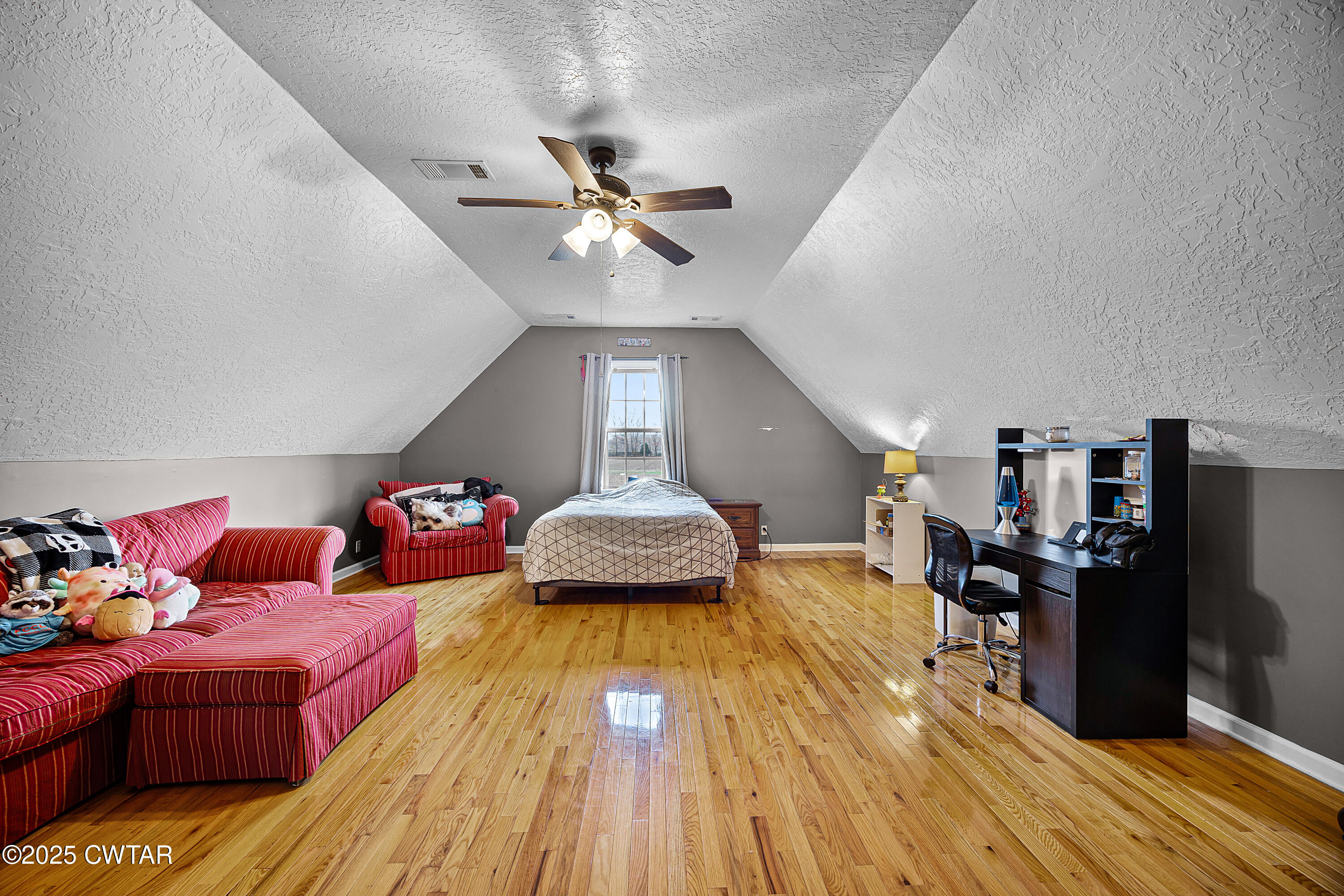31 Turkey Creek Road Medina, TN 38355 - Photo 18 of 21 a bedroom with furniture and a wooden floor