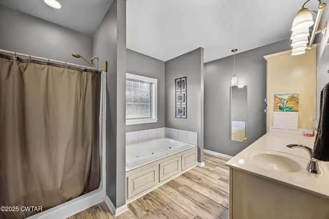 a workspace with wooden floor and a window