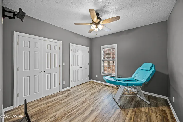 a view of walk in closet with clothes
