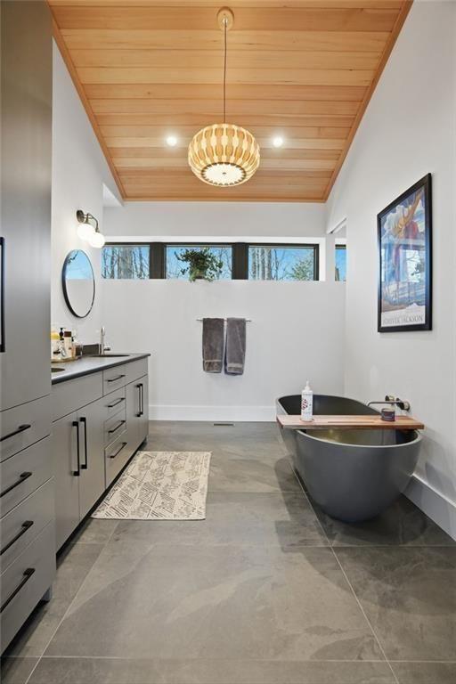7207 Ridgeview Drive Jasper, GA 30143 - Photo 23 of 46 a bathroom with a sink a vanity and a mirror
