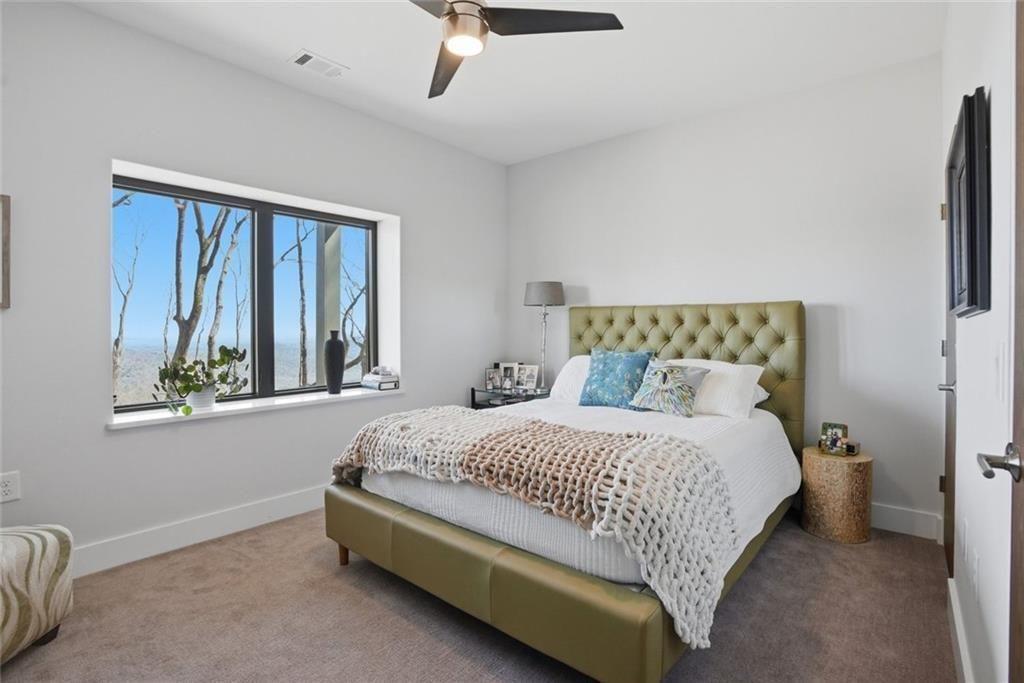 7207 Ridgeview Drive Jasper, GA 30143 - Photo 35 of 46 a bedroom with a bed lamp and window