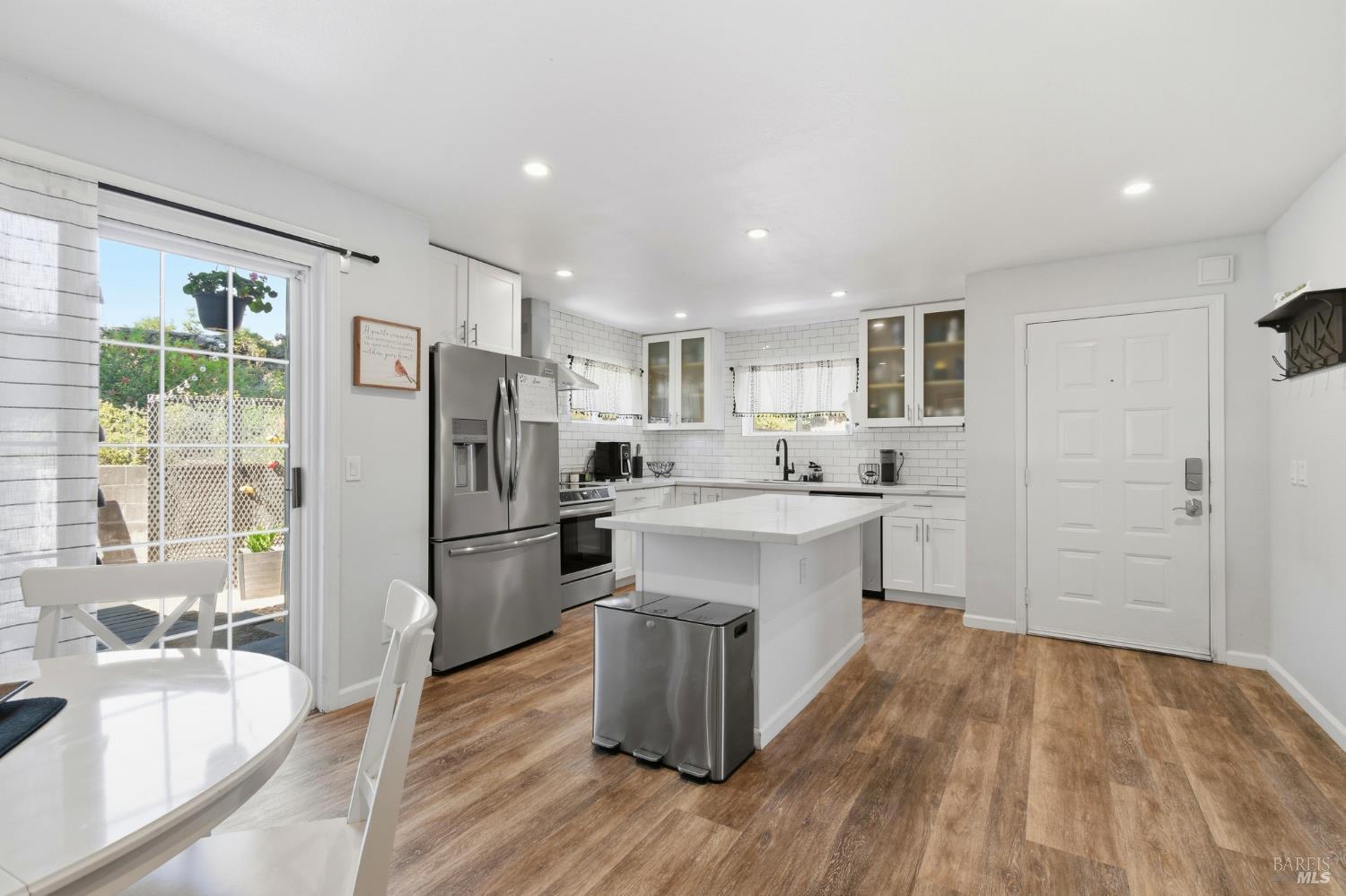 5193 Firestone Place Santa Rosa, CA 95409 - Photo 18 of 35 Effortless open-concept flow from the kitchen island through to the dining area, with sliding glass door access to the outdoors.