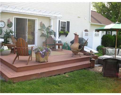 9 Columbia Road Middletown, RI 02842 - Photo 7 of 12 Patio/Deck. Deck & Patio off Great Room in back overlooking deep private yard