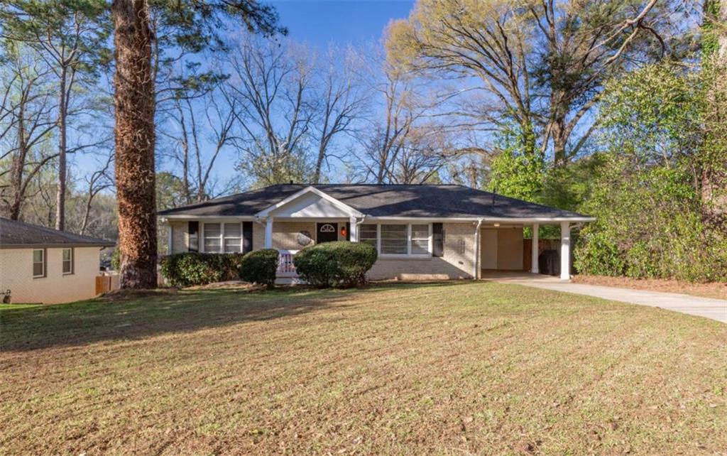 3592 Barrington Place Decatur, GA 30032 - Photo 2 of 32 a front view of a house with a yard
