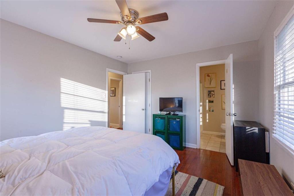 3592 Barrington Place Decatur, GA 30032 - Photo 21 of 32 a bedroom with a bed and a chandelier