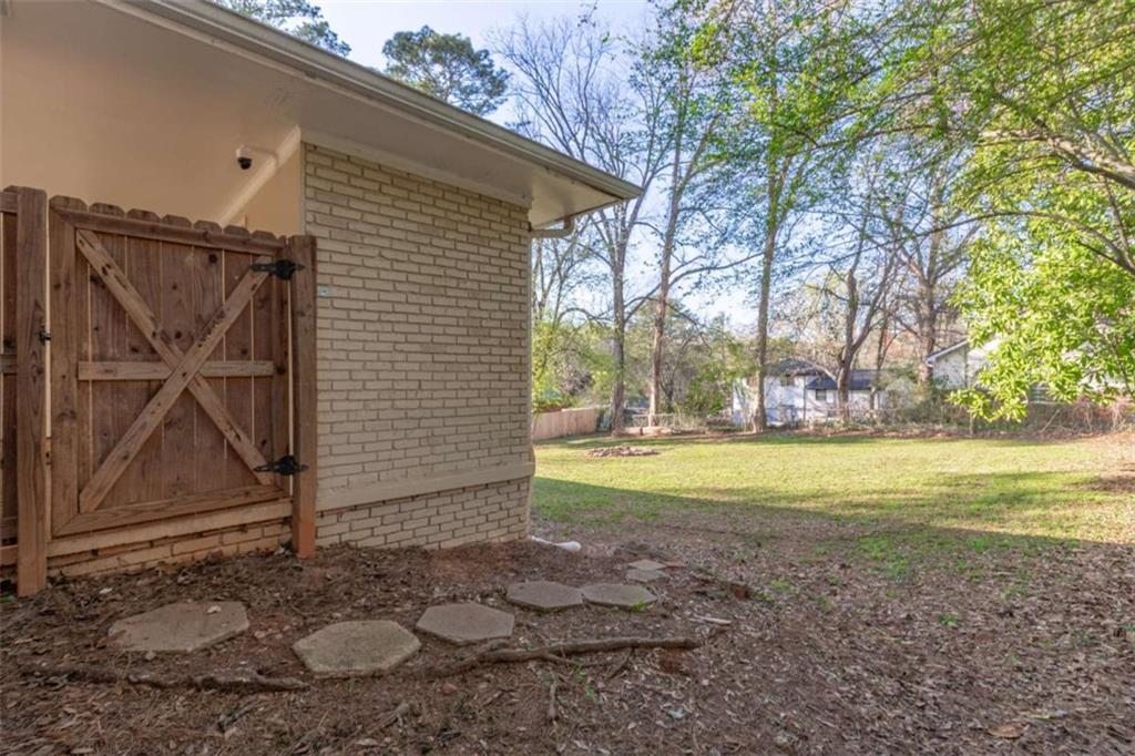 3592 Barrington Place Decatur, GA 30032 - Photo 25 of 32 a view of a house with backyard and porch