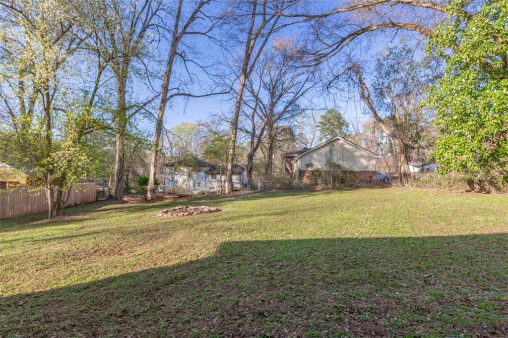 3592 Barrington Place Decatur, GA 30032 - Photo 30 of 32 a view of a yard with a large tree