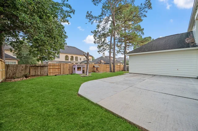 a front view of a house with garden and outdoor seating