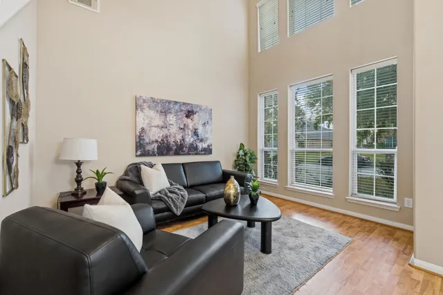 a living room with furniture and a window