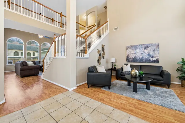 a living room with furniture and a rug
