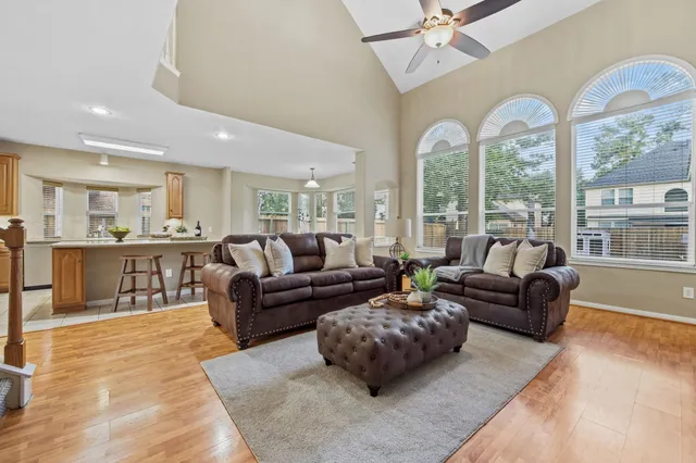 a living room with furniture and a large window