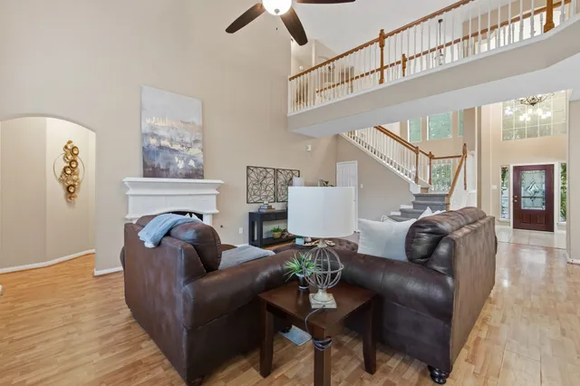 a living room with furniture and a fireplace