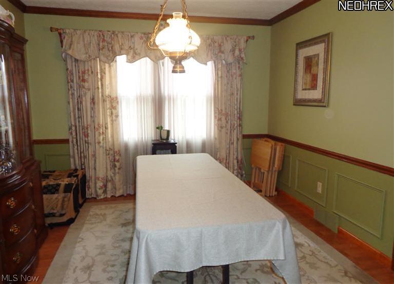 1530 Saxe Road Mogadore, OH 44260 - Photo 6 of 25 Dining room with crown molding, chair rail