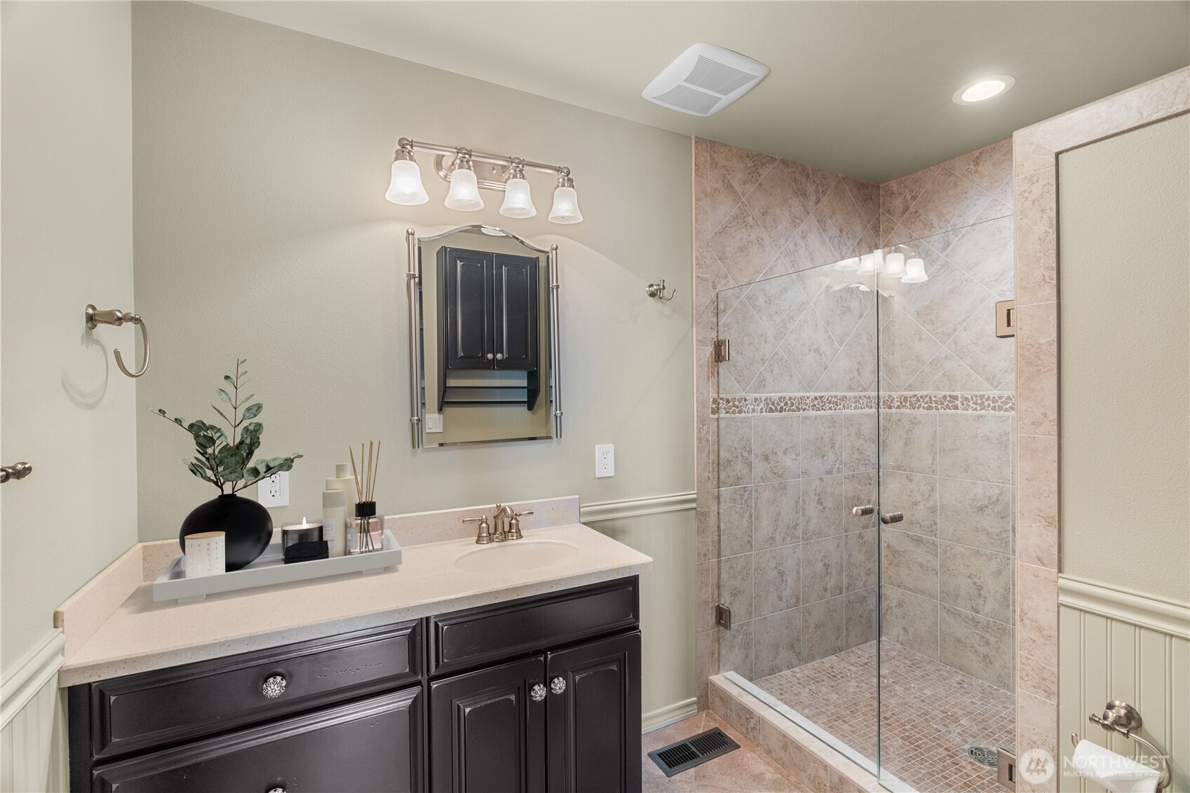 1233 Chilton Road Aberdeen, WA 98520 - Photo 13 of 40 a bathroom with a sink a light fixture and a glass door
