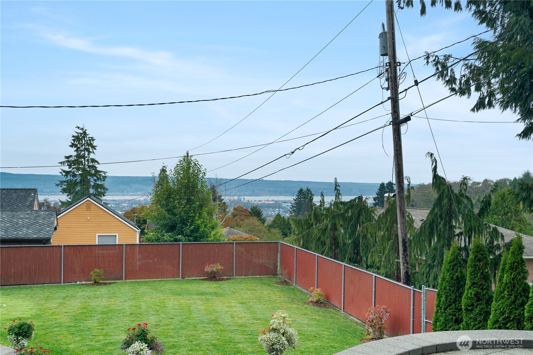 1233 Chilton Road Aberdeen, WA 98520 - Photo 33 of 40 a view of a backyard with potted plants and large trees