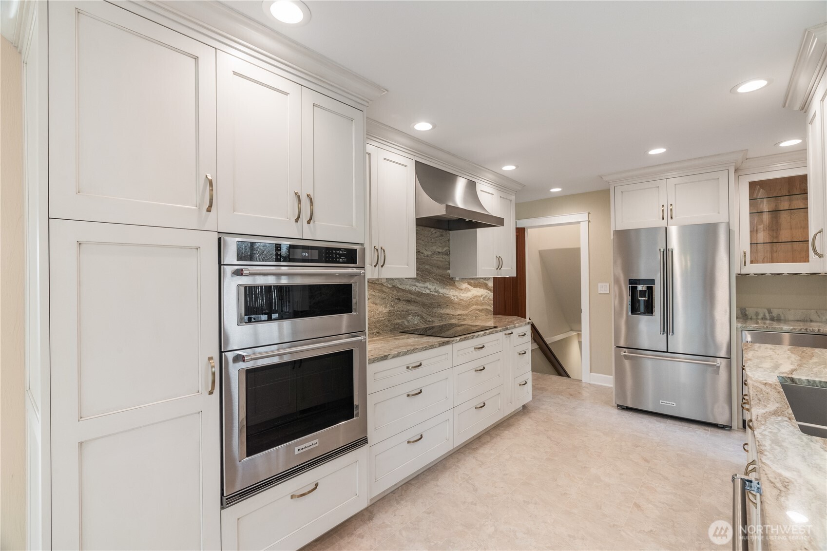 1233 Chilton Road Aberdeen, WA 98520 - Photo 7 of 40 a kitchen with stainless steel appliances kitchen island granite countertop a refrigerator and a stove top oven