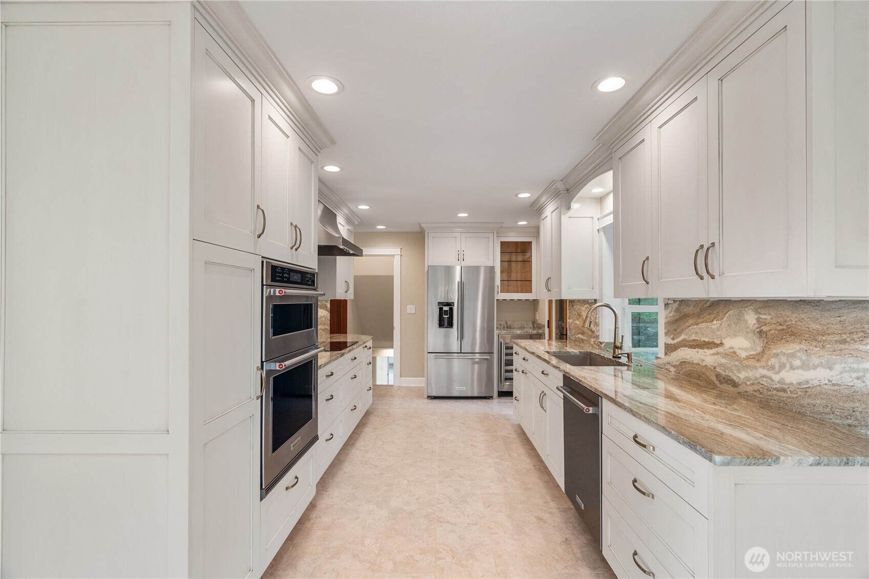 1233 Chilton Road Aberdeen, WA 98520 - Photo 10 of 40 a large kitchen with stainless steel appliances kitchen island granite countertop a large counter top and a stove top oven