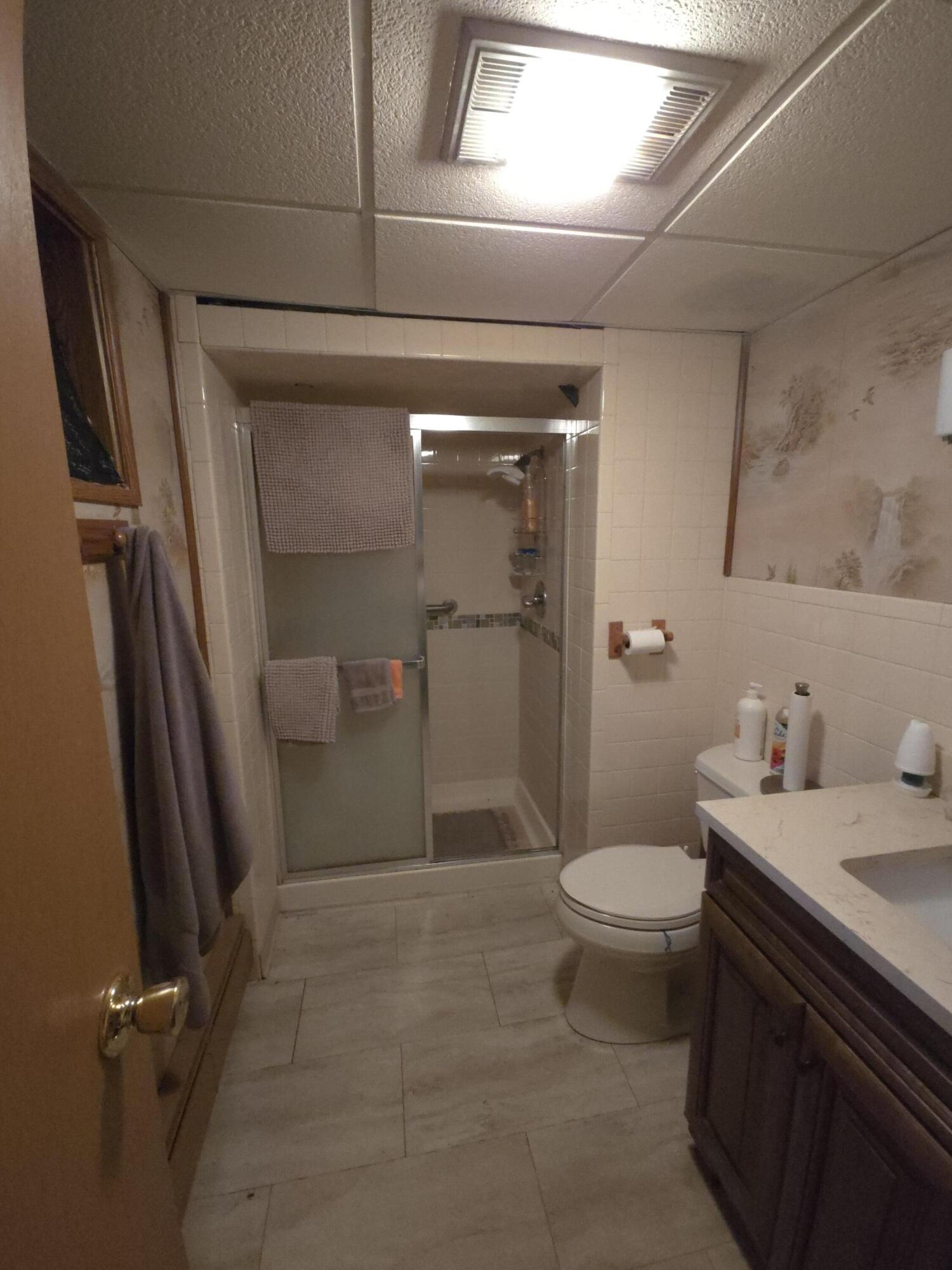 764 Hanley Street Gary, IN 46406 - Photo 12 of 15 a bathroom with a granite countertop sink toilet and shower
