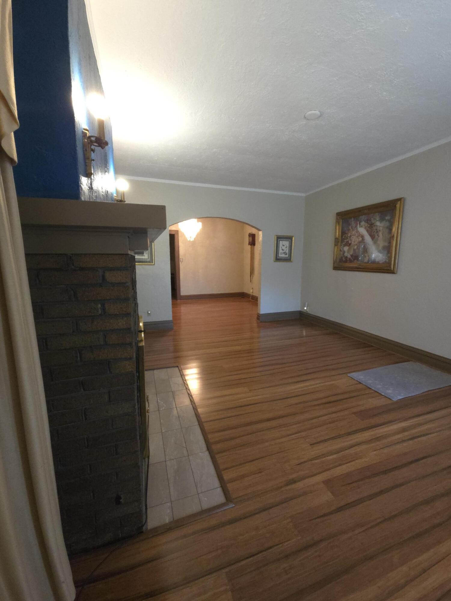 764 Hanley Street Gary, IN 46406 - Photo 3 of 15 a view of empty room with window and fireplace