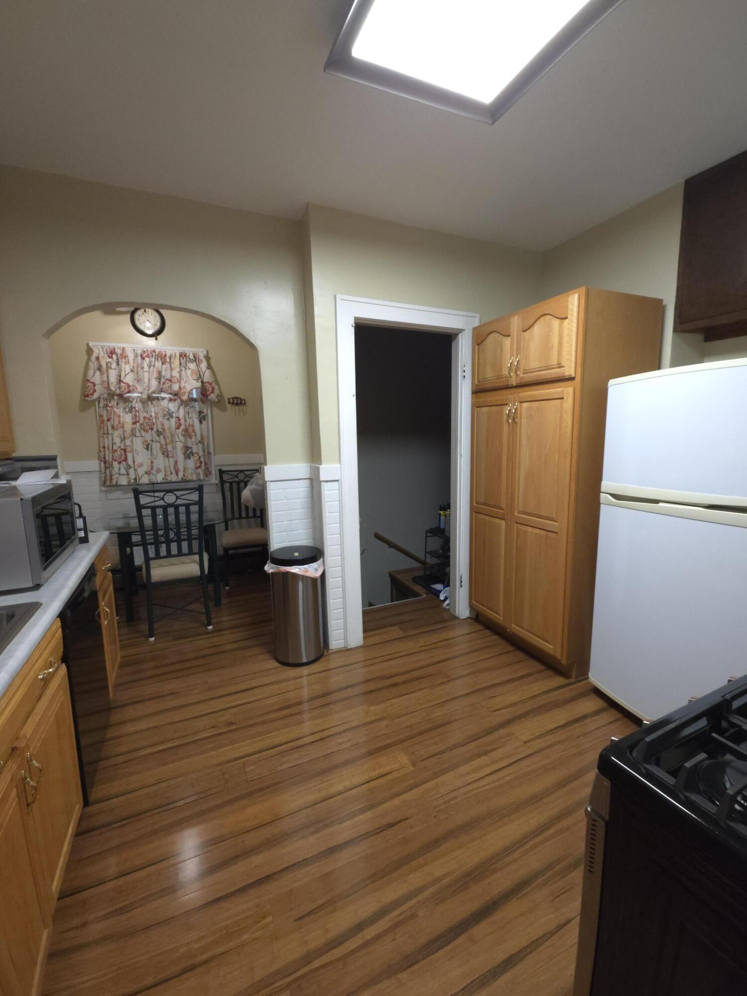764 Hanley Street Gary, IN 46406 - Photo 5 of 15 a kitchen with stainless steel appliances granite countertop a refrigerator and a stove