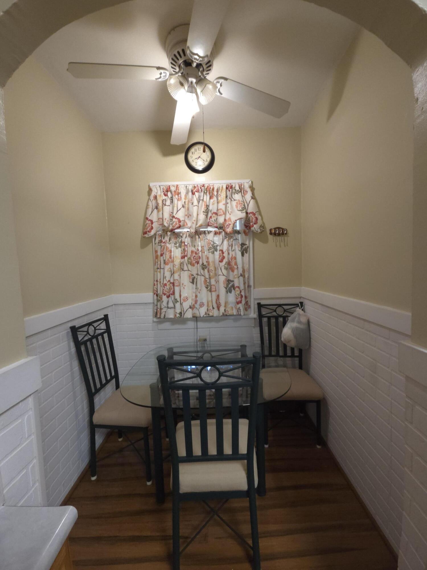 764 Hanley Street Gary, IN 46406 - Photo 7 of 15 a view of a dining room with furniture and wooden floor