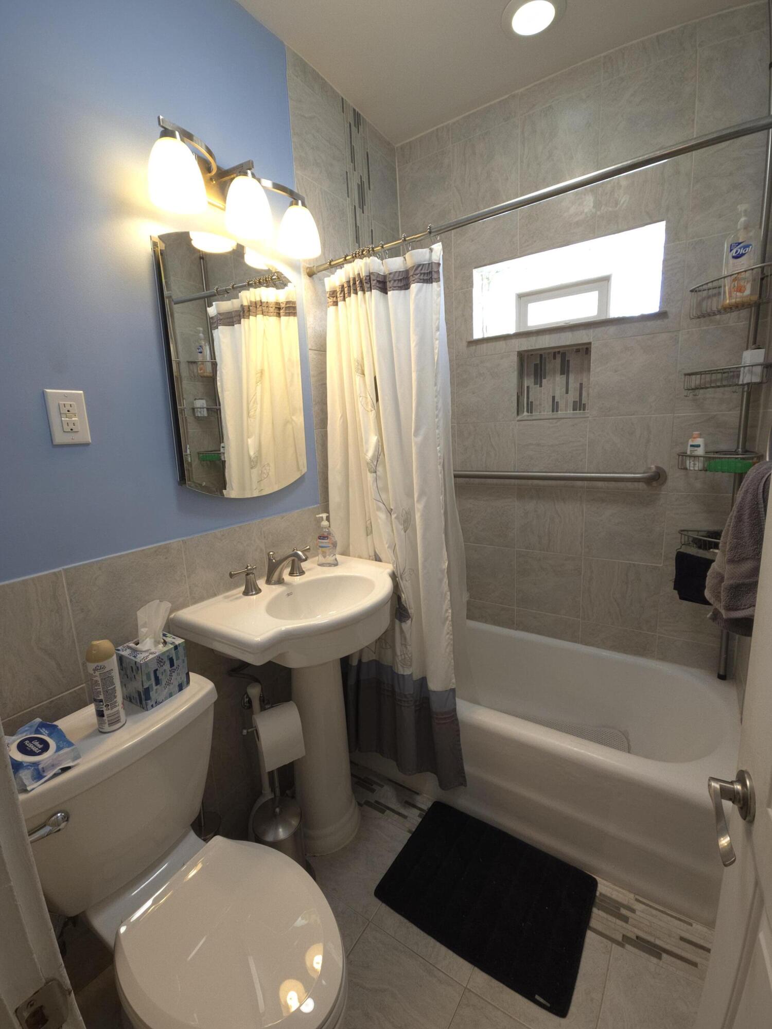 764 Hanley Street Gary, IN 46406 - Photo 9 of 15 a bathroom with a sink toilet and shower