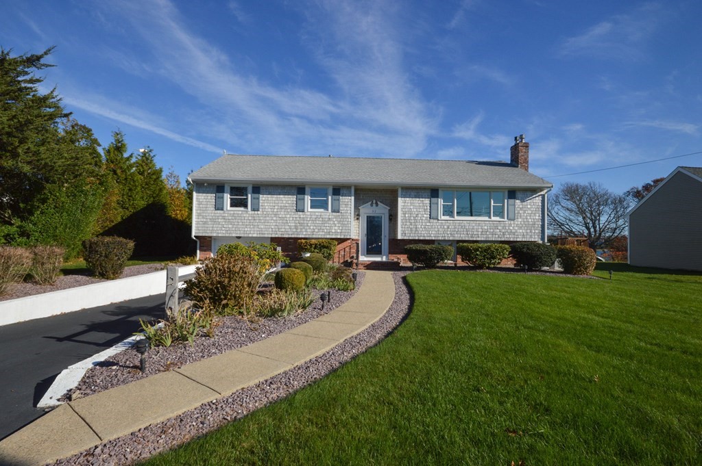 32 Pine Tree Drive Wareham, MA 02532 - Photo 1 of 1 a front view of a house with a garden