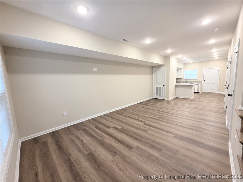 1511 Fort Bragg Road, Unit E Fayetteville, NC 28305 - Photo 12 of 17 a view of empty room with wooden floor
