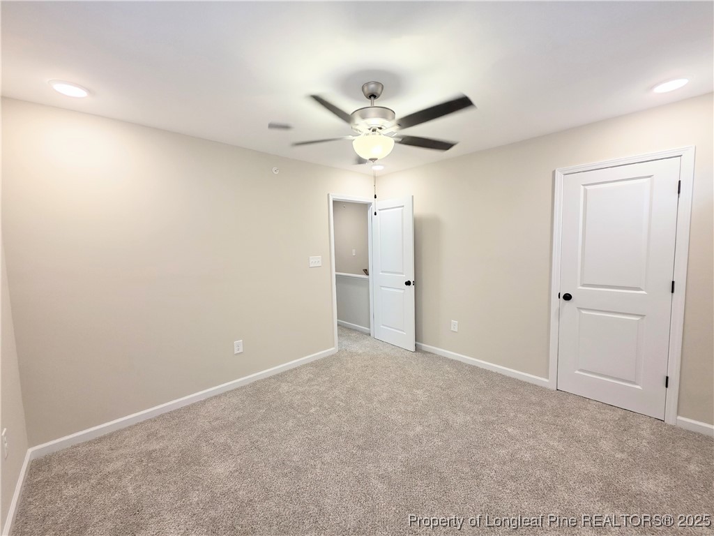 1511 Fort Bragg Road, Unit E Fayetteville, NC 28305 - Photo 13 of 17 an empty room with fan and a ceiling fan