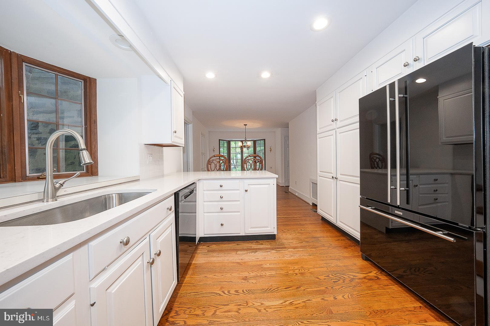 55 Wistar Road Villanova, PA 19085 - Photo 13 of 51 a large kitchen with stainless steel appliances a large counter top a stove and a refrigerator