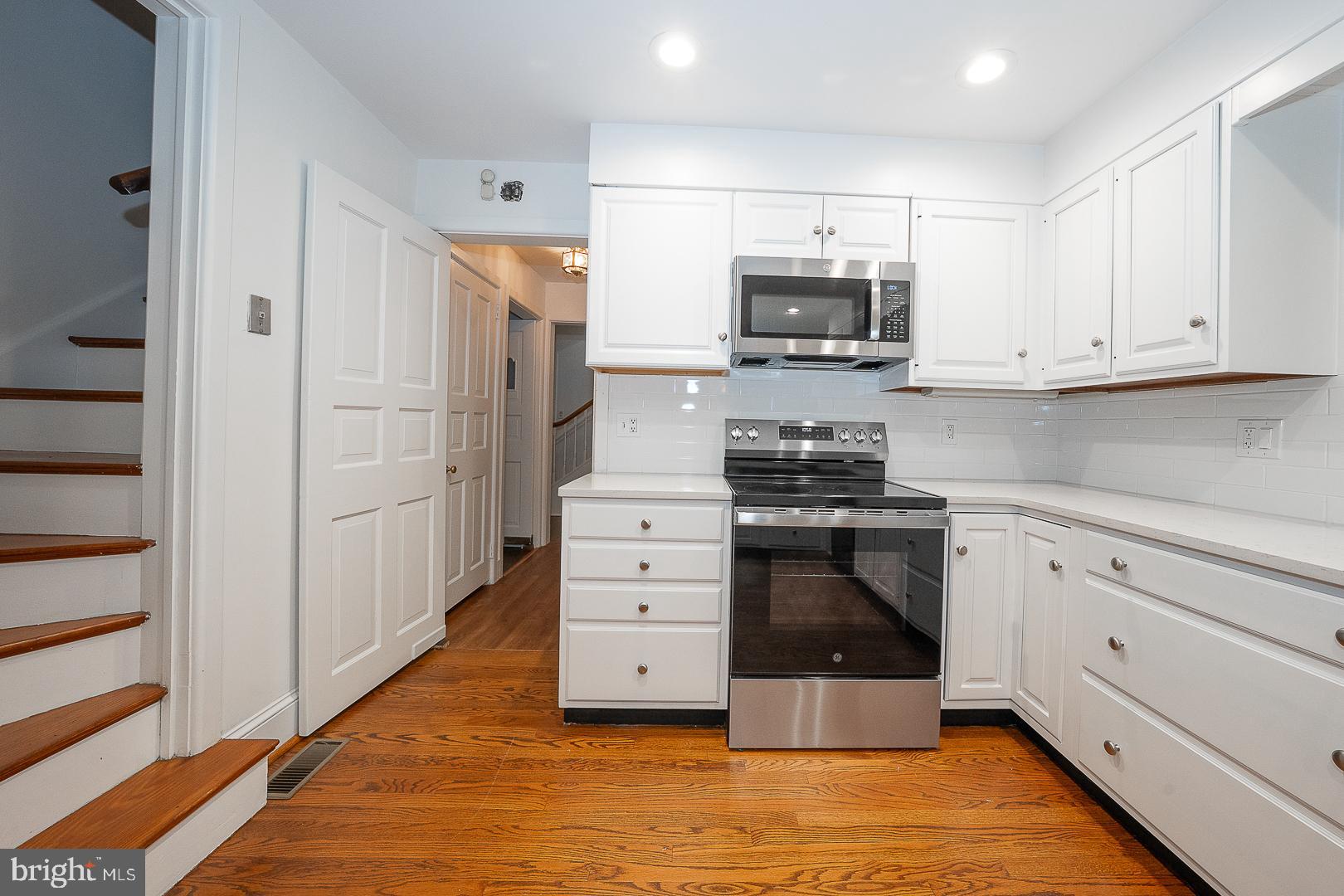 55 Wistar Road Villanova, PA 19085 - Photo 14 of 51 a kitchen with stainless steel appliances white cabinets and a stove top oven