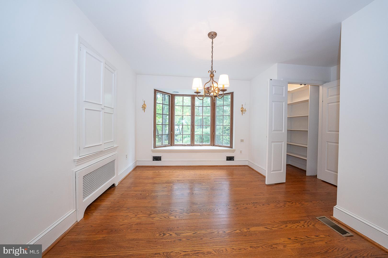 55 Wistar Road Villanova, PA 19085 - Photo 18 of 51 a view of an empty room with window and wooden floor