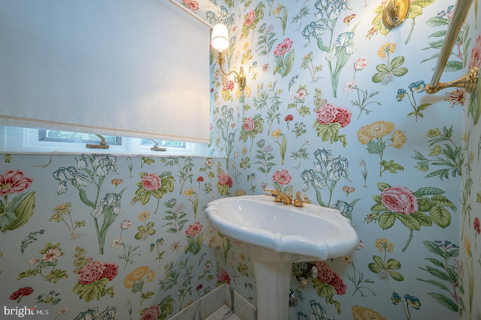 55 Wistar Road Villanova, PA 19085 - Photo 20 of 51 a bathroom with a sink and mirror with painted walls