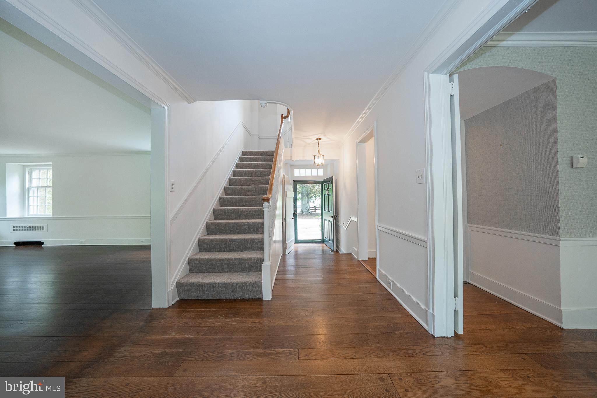 55 Wistar Road Villanova, PA 19085 - Photo 2 of 51 a view of a hallway with entryway wooden floor and front door