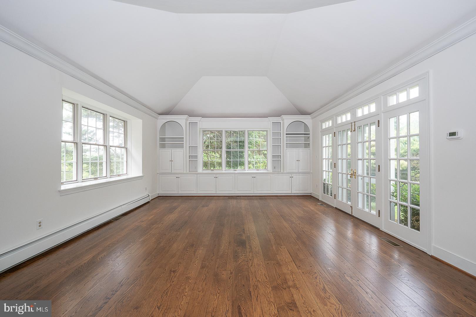 55 Wistar Road Villanova, PA 19085 - Photo 21 of 51 an empty room with wooden floor and windows