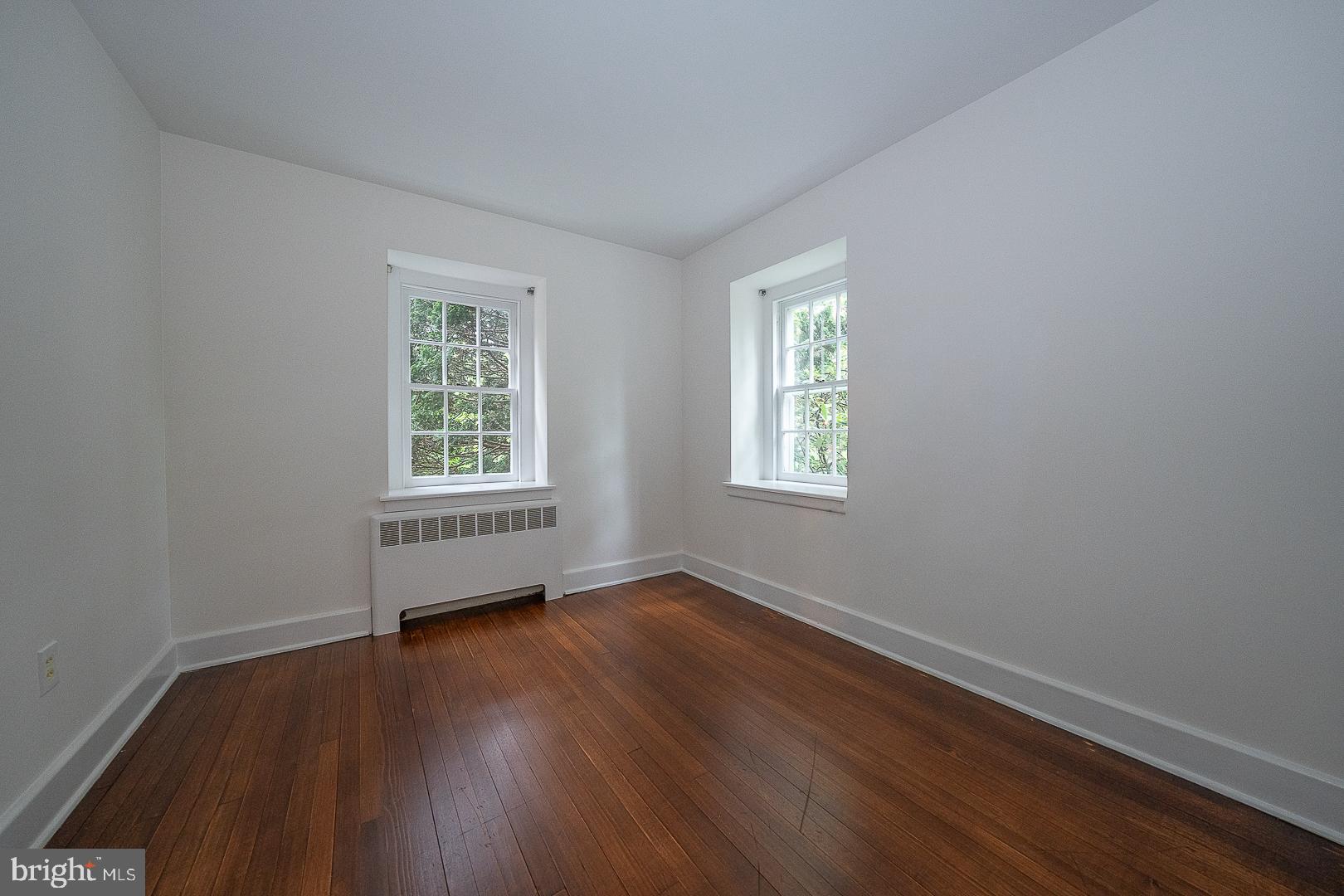 55 Wistar Road Villanova, PA 19085 - Photo 28 of 51 an empty room with wooden floor and windows