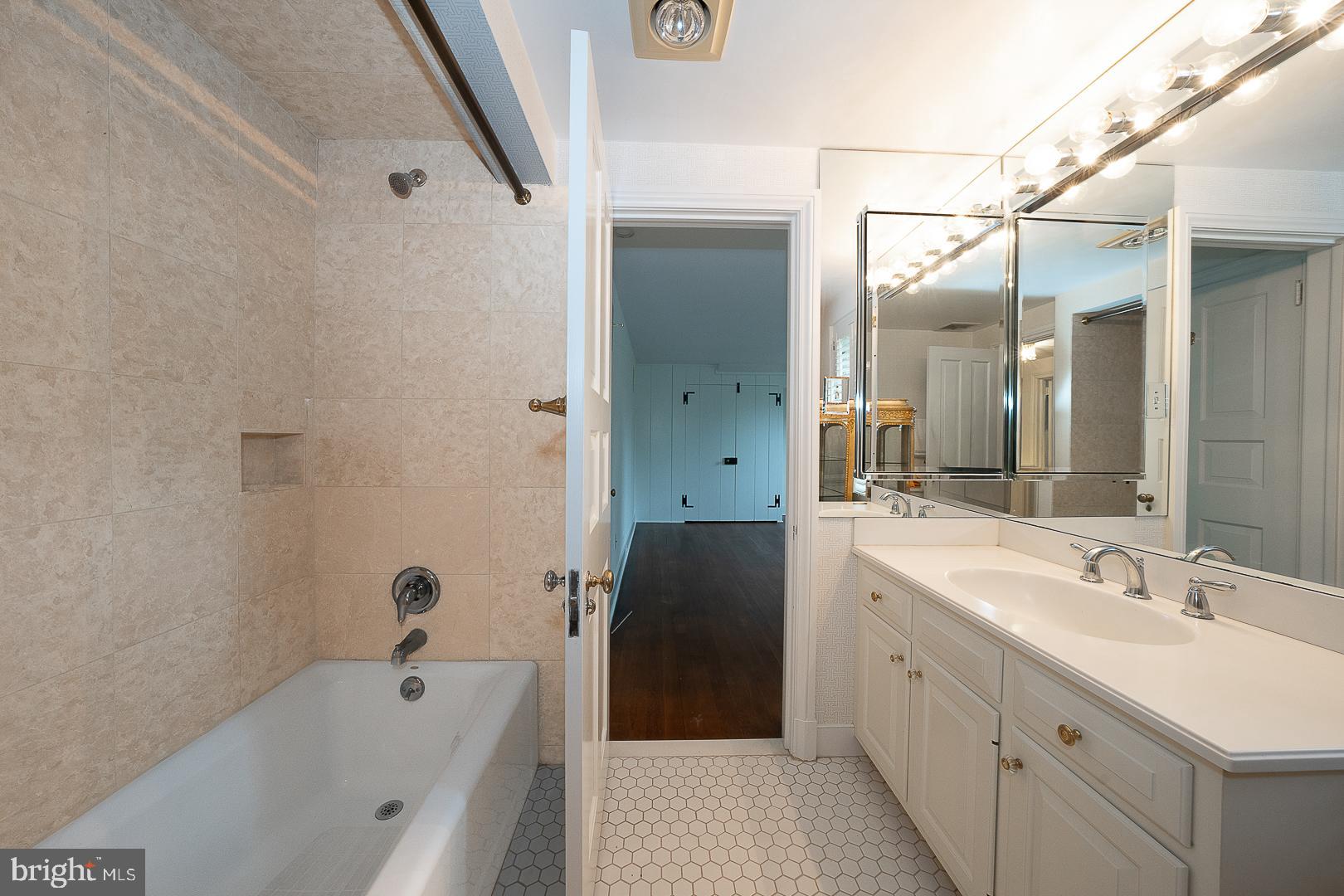 55 Wistar Road Villanova, PA 19085 - Photo 36 of 51 a bathroom with a tub sink and mirror