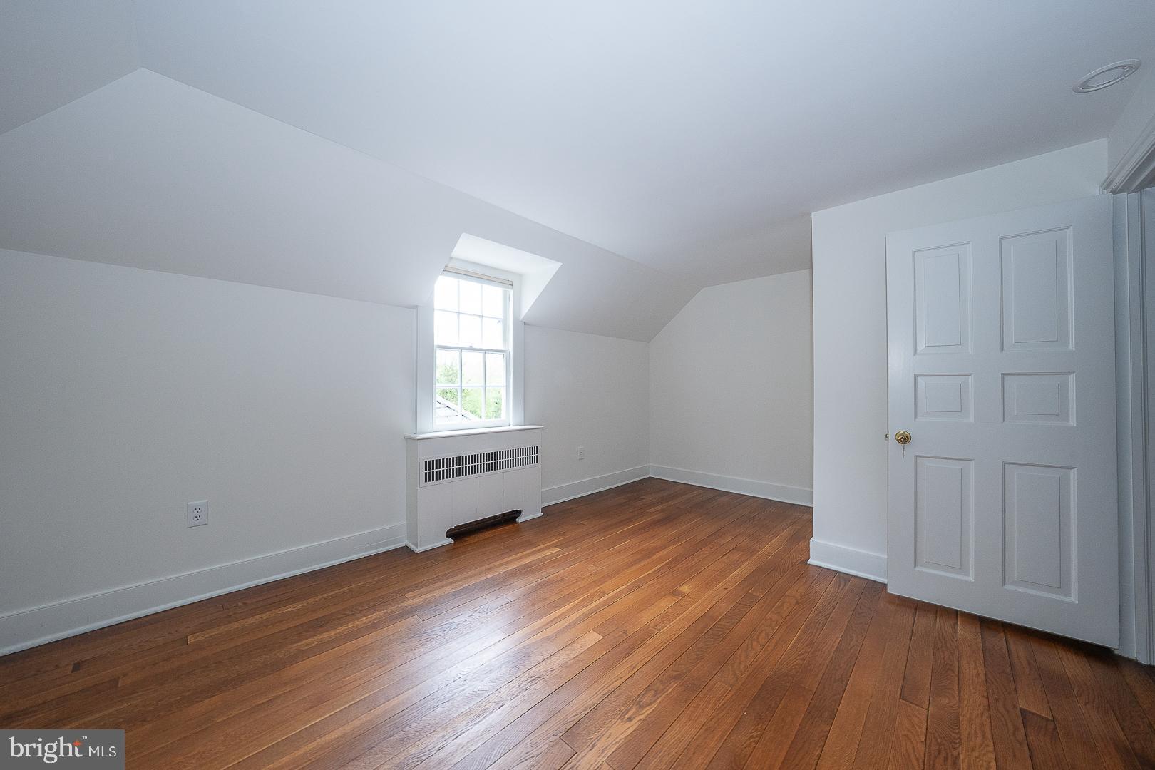 55 Wistar Road Villanova, PA 19085 - Photo 37 of 51 an empty room with wooden floor and windows