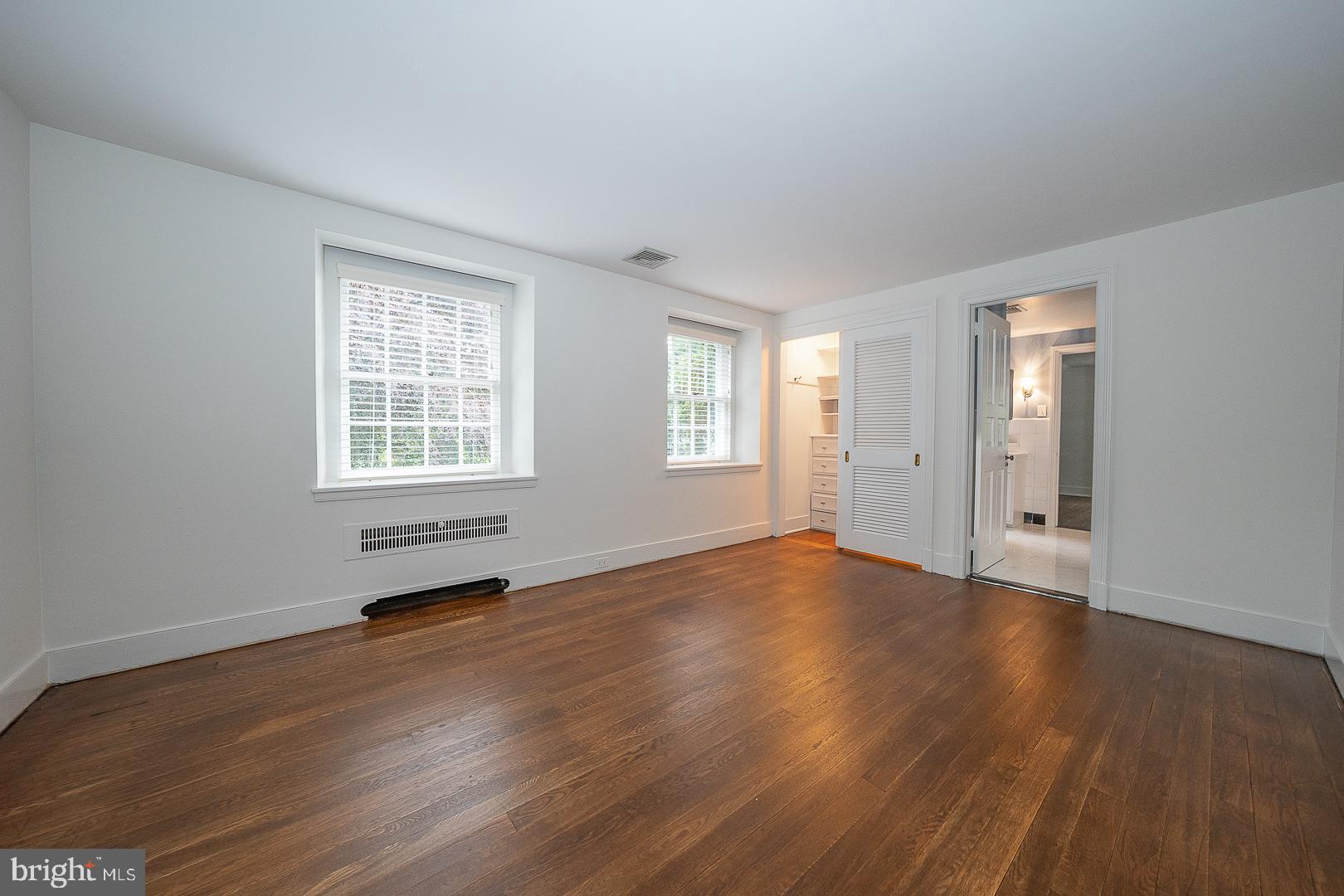 55 Wistar Road Villanova, PA 19085 - Photo 40 of 51 an empty room with wooden floor and windows