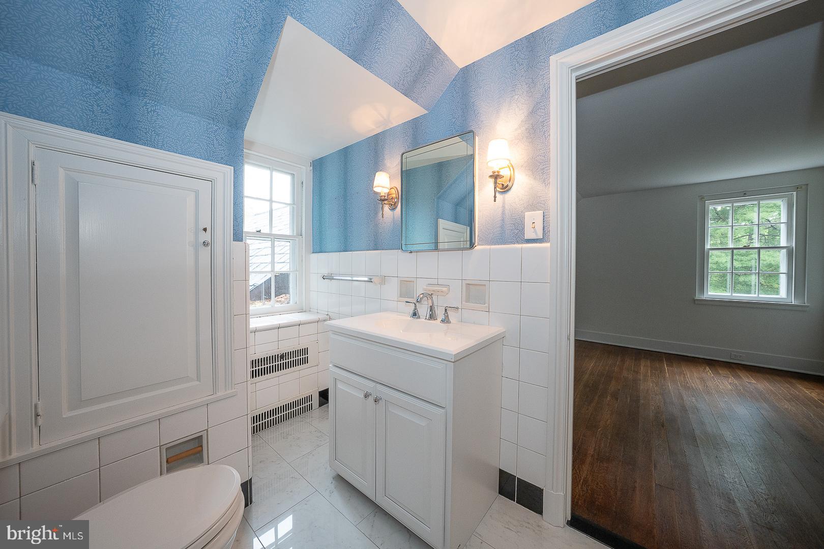 55 Wistar Road Villanova, PA 19085 - Photo 41 of 51 a bathroom with a sink toilet vanity and window