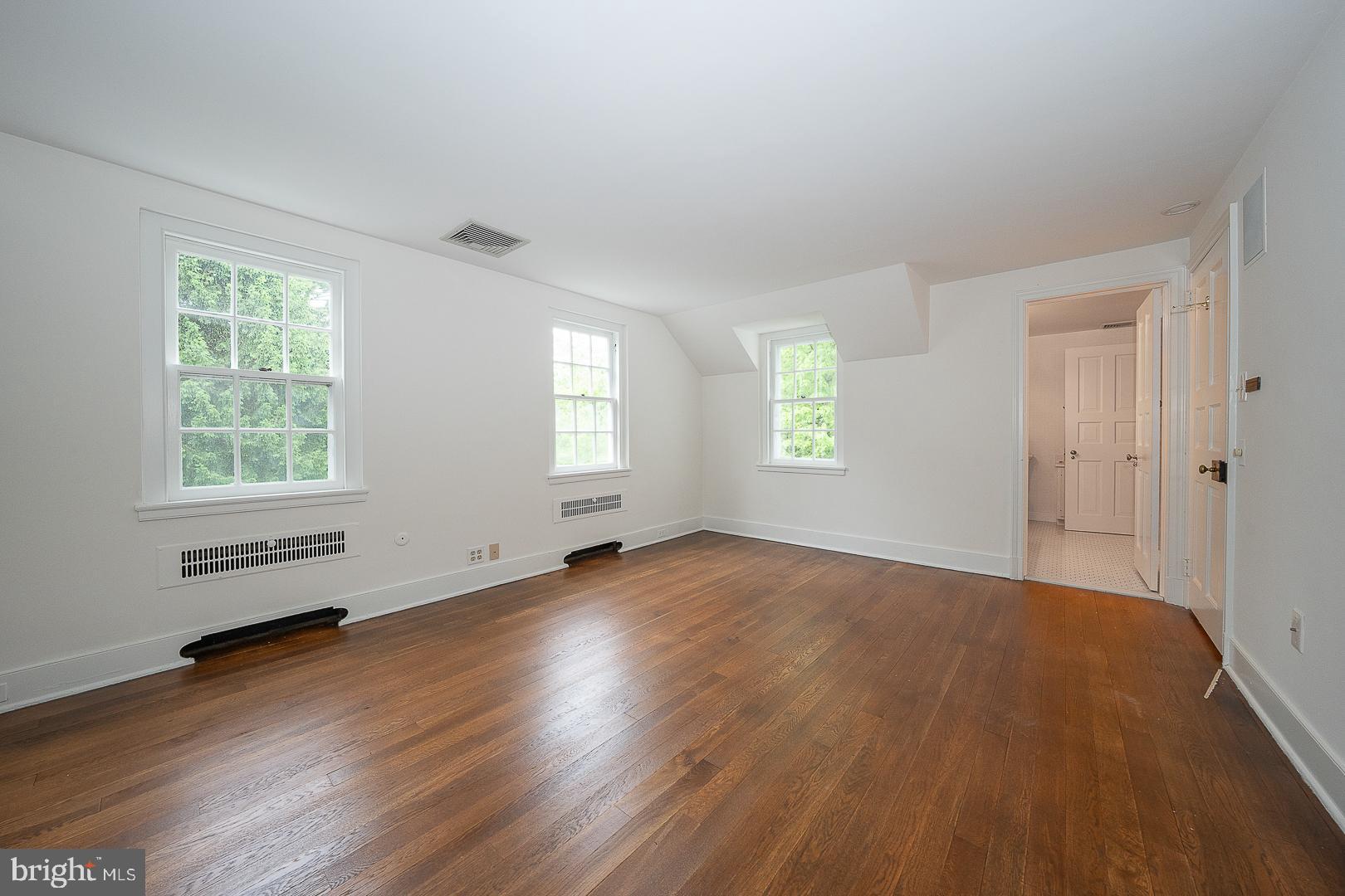 55 Wistar Road Villanova, PA 19085 - Photo 43 of 51 an empty room with wooden floor and windows