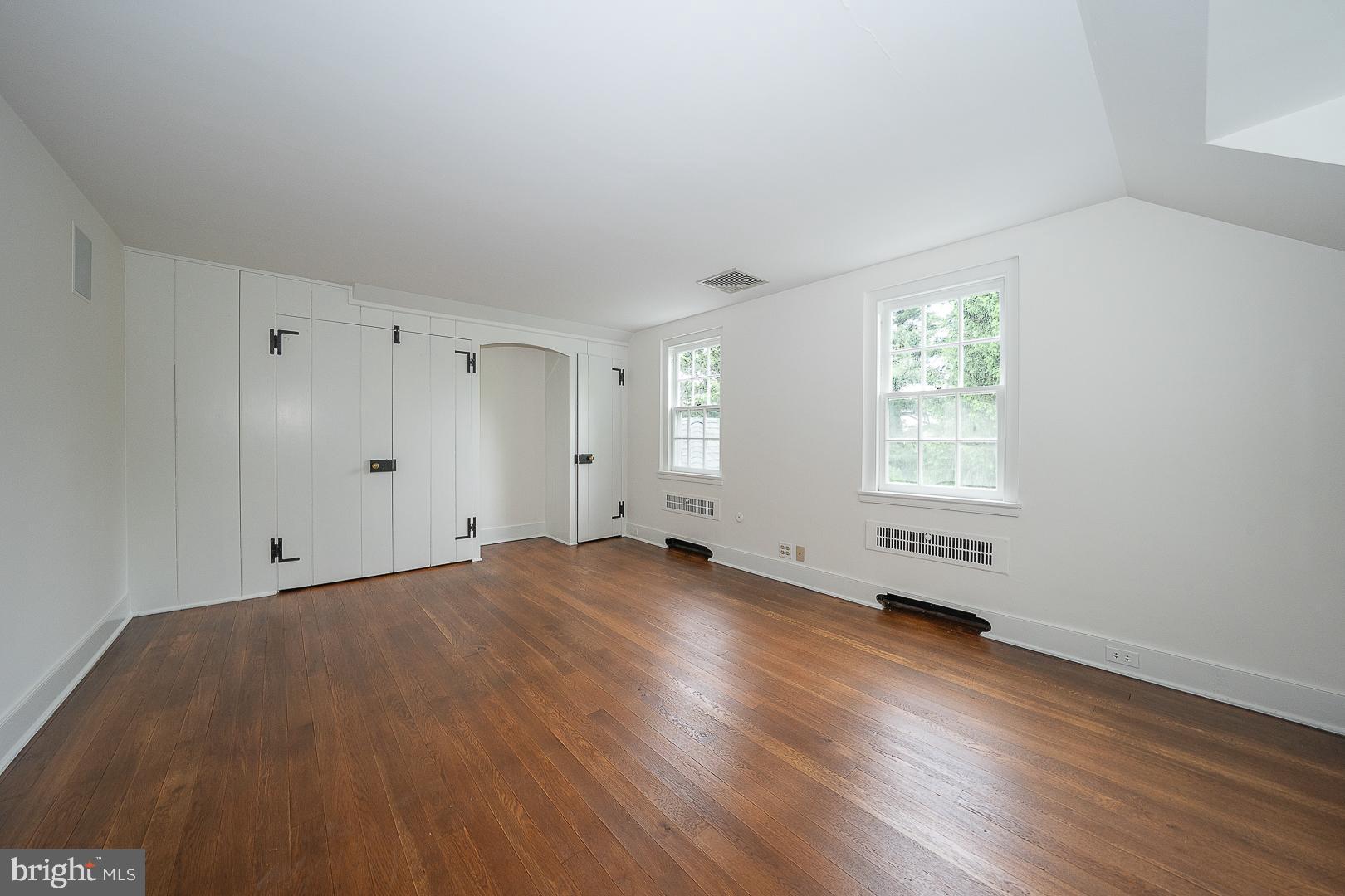 55 Wistar Road Villanova, PA 19085 - Photo 45 of 51 an empty room with wooden floor and windows