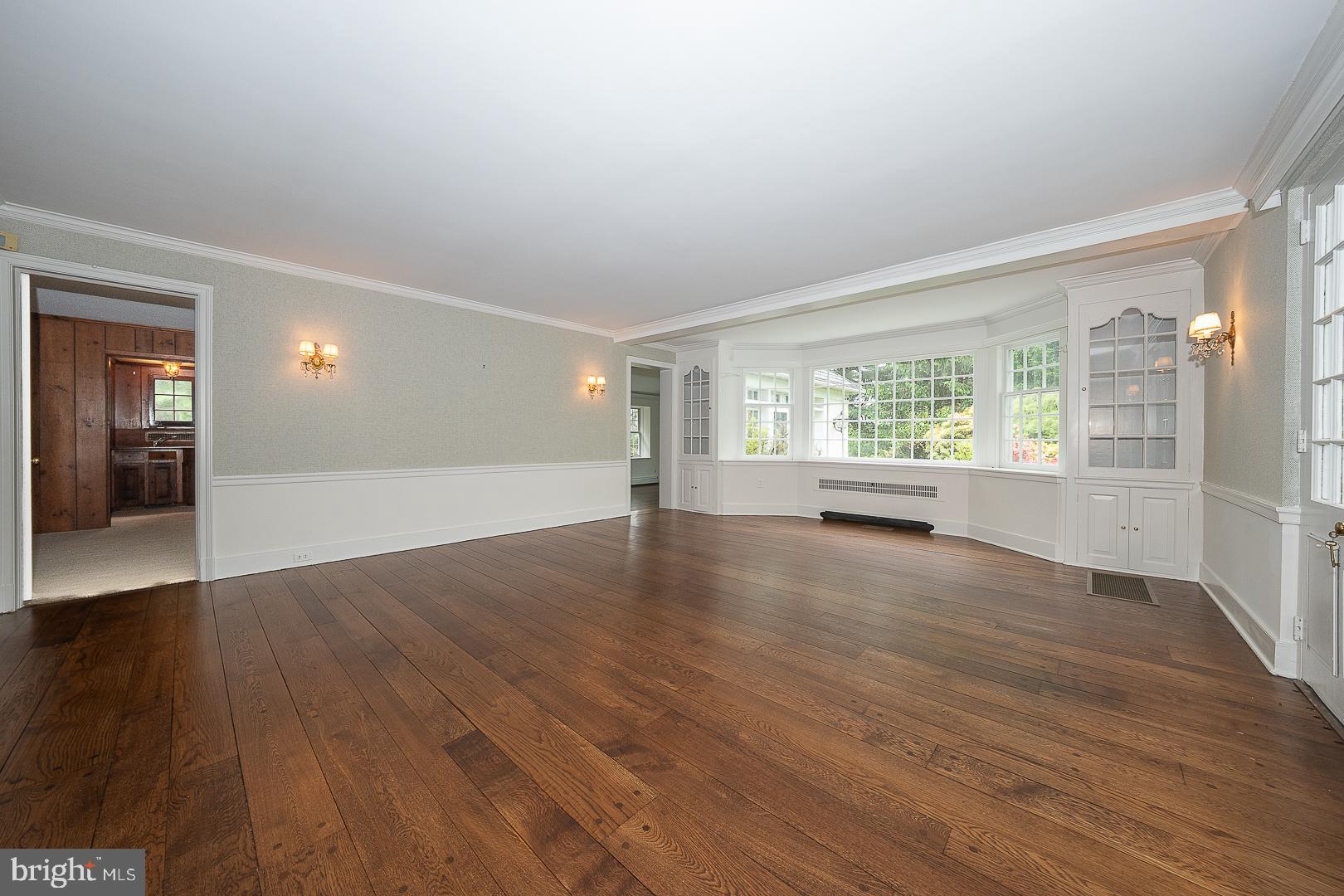 55 Wistar Road Villanova, PA 19085 - Photo 8 of 51 an empty room with wooden floor and windows