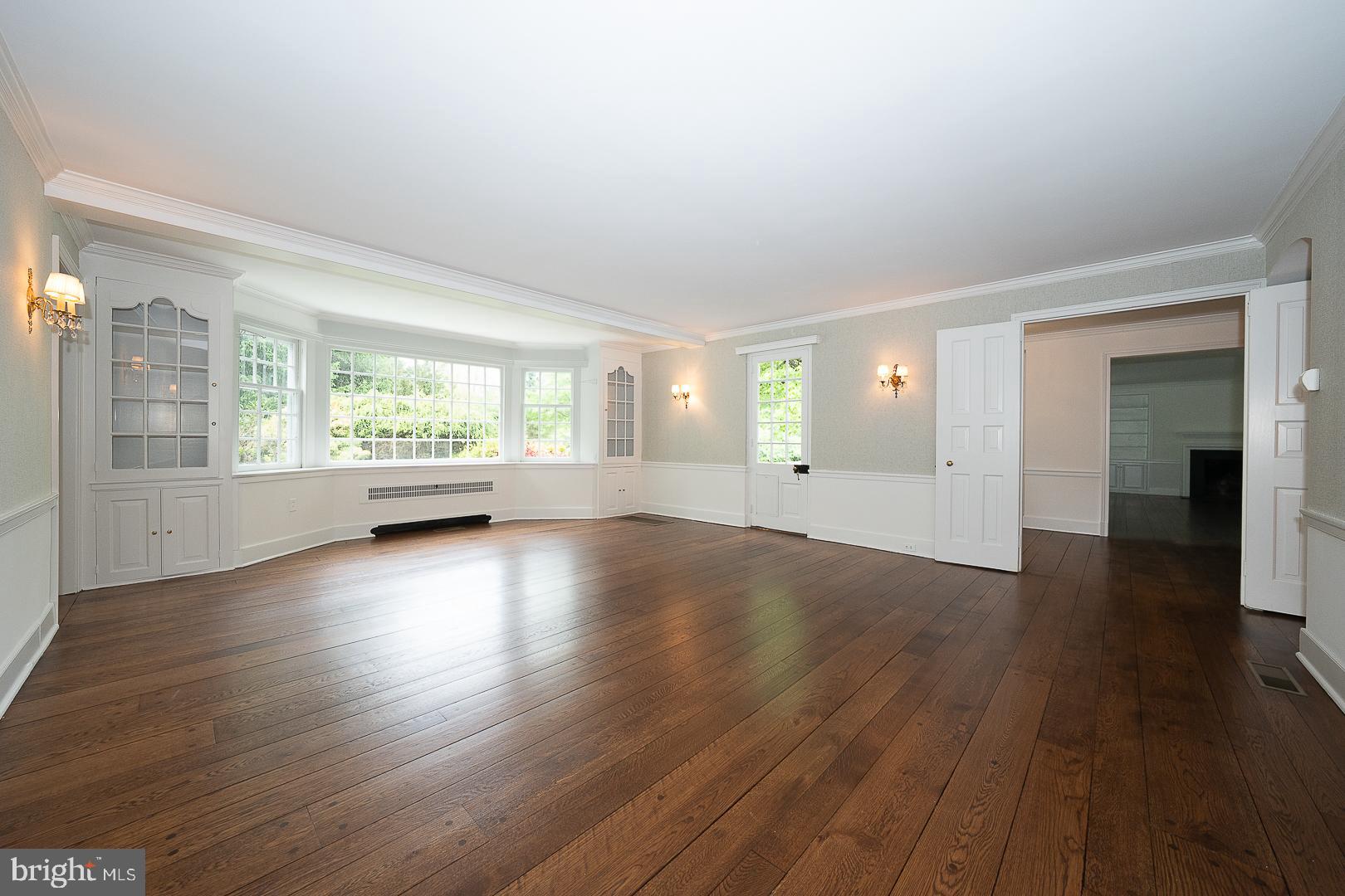 55 Wistar Road Villanova, PA 19085 - Photo 9 of 51 an empty room with wooden floor and windows