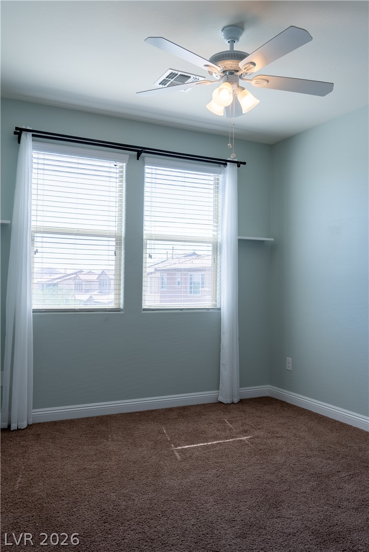 11045 Elk Sands Road Las Vegas, NV 89179 - Photo 61 of 67 Double windows invite natural light across the plush neutral carpeting in this cozy space.