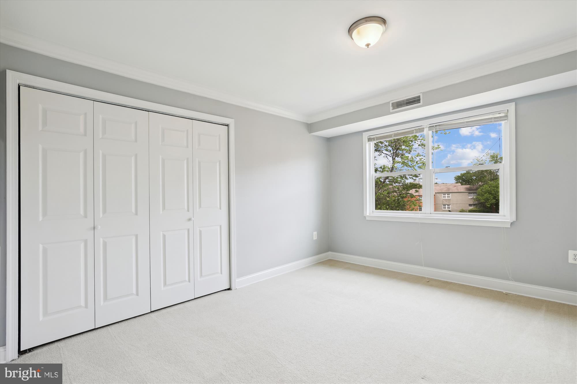 5909 Quantrell Avenue, Unit 203 Alexandria, VA 22312 - Photo 19 of 33 an empty room with windows
