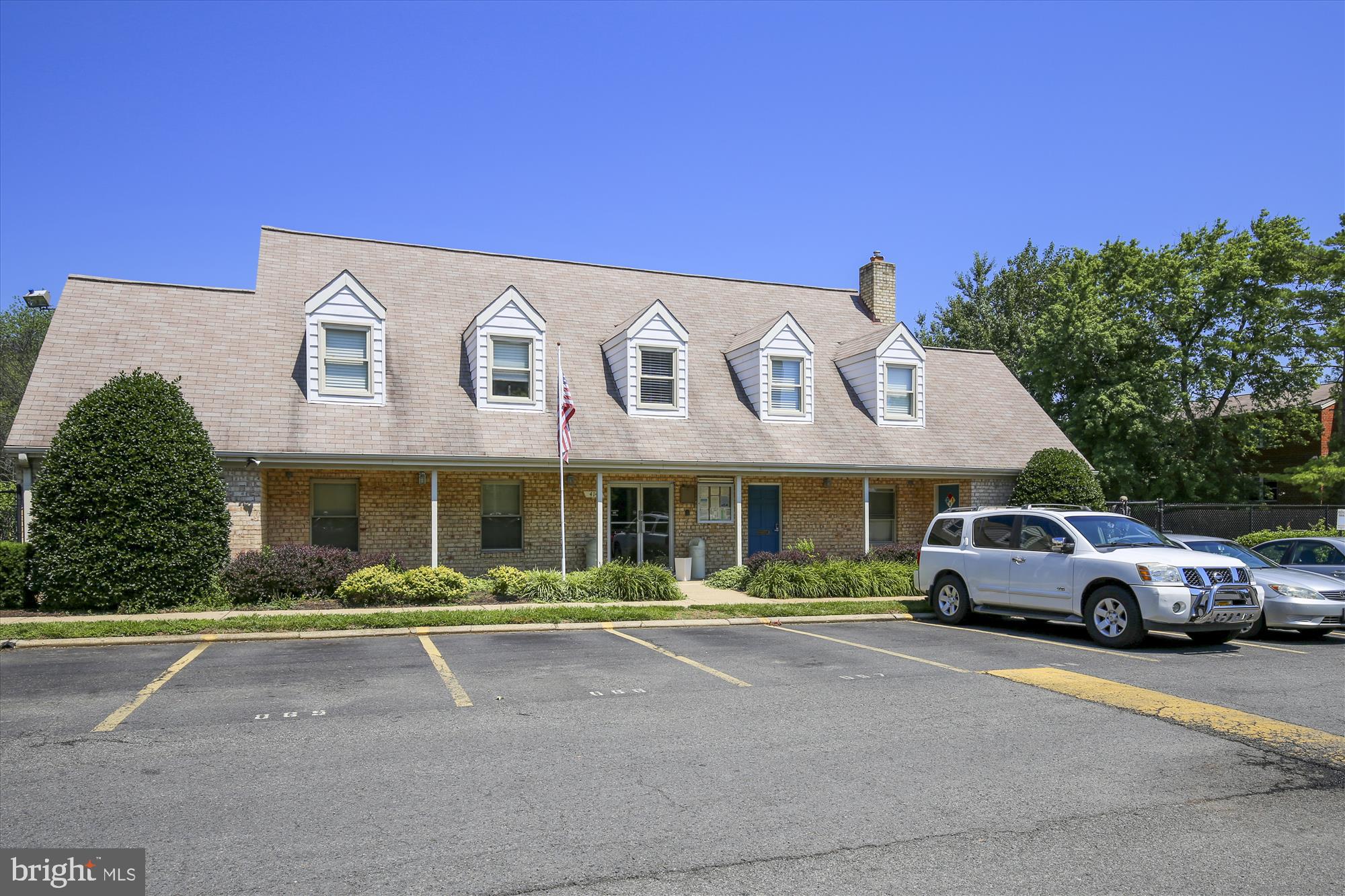 5909 Quantrell Avenue, Unit 203 Alexandria, VA 22312 - Photo 28 of 33 a front view of a building with street view