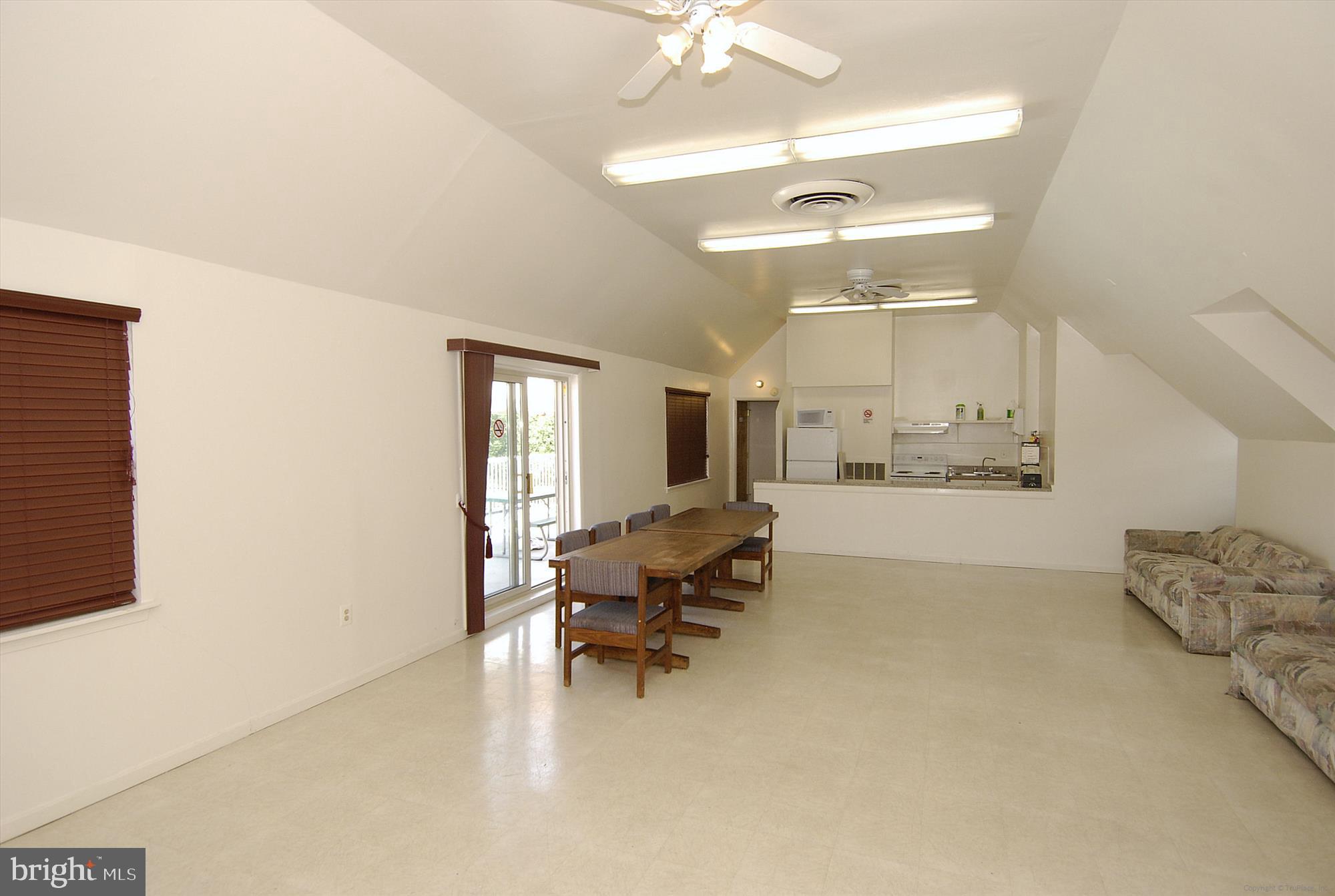 5909 Quantrell Avenue, Unit 203 Alexandria, VA 22312 - Photo 30 of 33 a living room with furniture and kitchen view