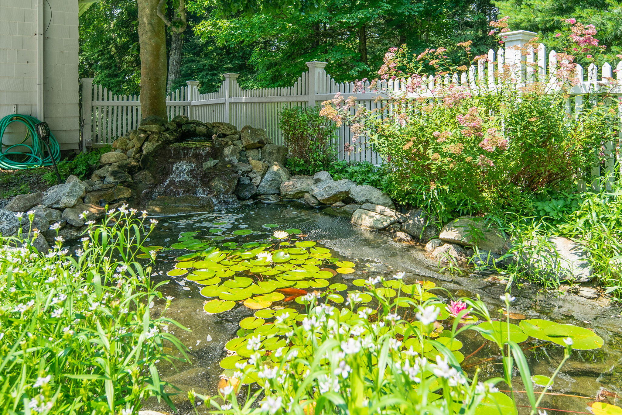 2061 Ponus Ridge Road New Canaan, CT 06840 - Photo 15 of 50 a view of garden with statue